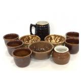 Ten assorted brown ceramic crocks