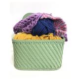 Collection of yarn and partial crochet pieces