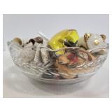 Glass bowl of assorted vintage items