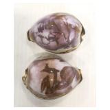Two painted and decorated sea shells