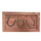 Framed & mounted antique horseshoes