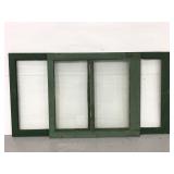 Two green painted wood framed rustic window panels