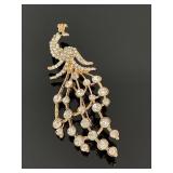 Rhinestone & rose gold tone peacock brooch