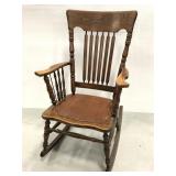 Vintage wood rocking chair with covered seat