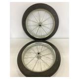 Two small tractor wheels with rims