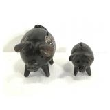 Pair of ornate carved pigs