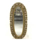 Gold toned ornate trimmed oval decorative mirror