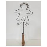 Small doll shaped vintage rug beater