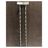 Two painted metal hanging display clips