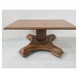 Small faux wood coffee table on casters