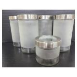 Five frosted glass Ikea kitchen jars