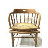Vintage woven seat wood chair that reclines back