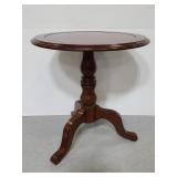 Dark wood round accent table