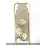 Vintage ironing board with daisy cover