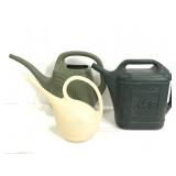 Trio of plastic watering cans