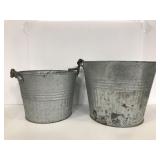 Two galvanized metal planters