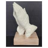 White ceramic prayer hands decorative piece