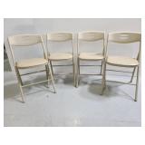 Set of 4 tan Cosco plastic back metal folding