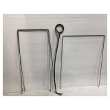 Three yard garden stakes and one fire pit poker