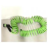 Green spiral garden hose