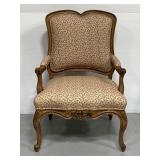 Ornate carved French Provincial style armchair