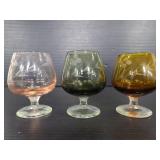 Trio of tiny colored glass whiskey snifters