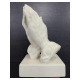 Ceramic praying hand sculpture