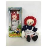 Two Raggedy Ann dolls