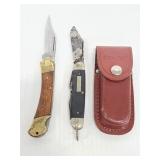 Two vintage pocket knives and leather sheath