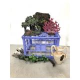 Milk crate of assorted aquarium decor