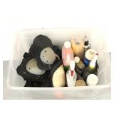 Tote of assorted cleaners and knee pads