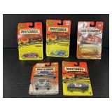 Five Matchbox diecast cars new in package
