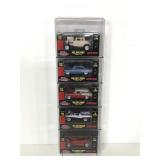 5 Racing champions die cast cars in display case