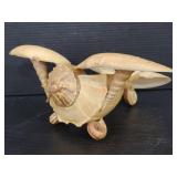 Decorative airplane made of seashells