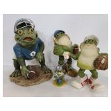 Four resin frogs with sports gear