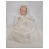 Vintage porcelain baby doll in christening dress