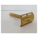Vintage gold tone Silver Star metal razor