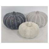 Three decorative cement pumpkins