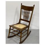 Antique wooden rocking chair w/ cane seat