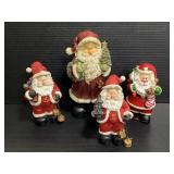Collection of four Santa Claus figures
