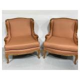 Pair of matching salmon colored wing back chairs