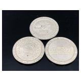 Three assorted casino dollar coins