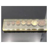 Seven ancient Roman coin lucite