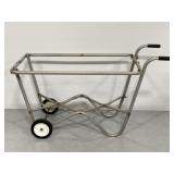 Vintage metal trash can caddy on wheels
