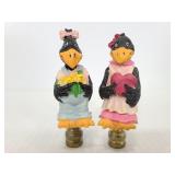 Two resin black bird finials