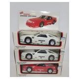 Three Iroc racing Dodge Daytona cars in boxes