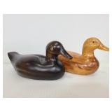 Two carved wood ducks