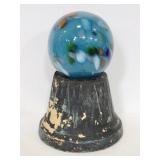 Chippy black pedestal w/ colorful glass orb