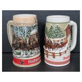 Two budweiser Clydesdale holiday beer steins
