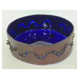 Blue dish inside metal ring